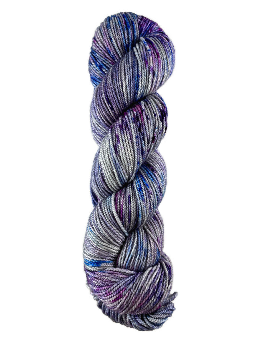 A blue and purple skein of Western Sky Knits Merino 17 DK yarn