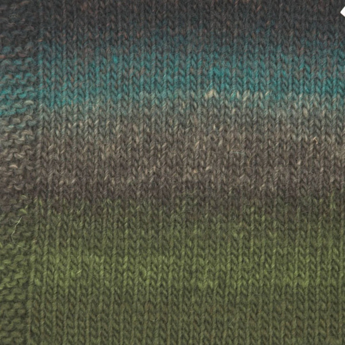 A photo of a green, gray, and blue yarn sample