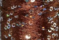 A close-up photo of SWTC String Me Along brown colored sequined thread