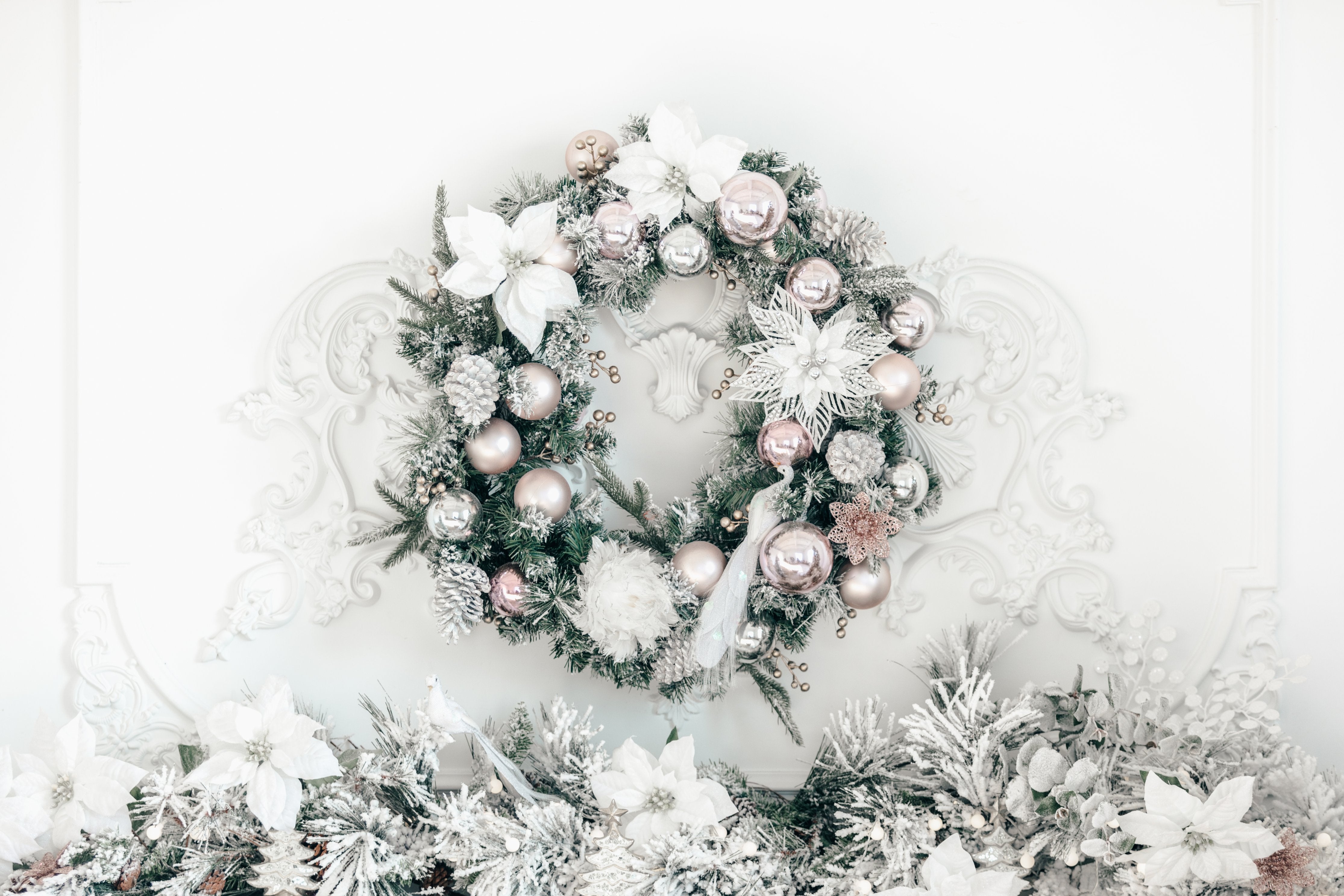 A white and silver Christmas wreath and garland