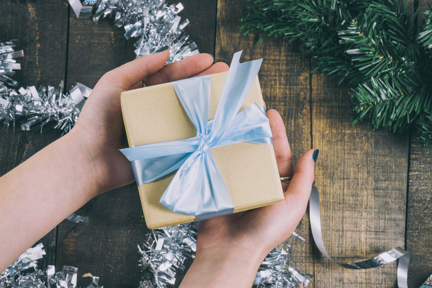 Two hands with a present