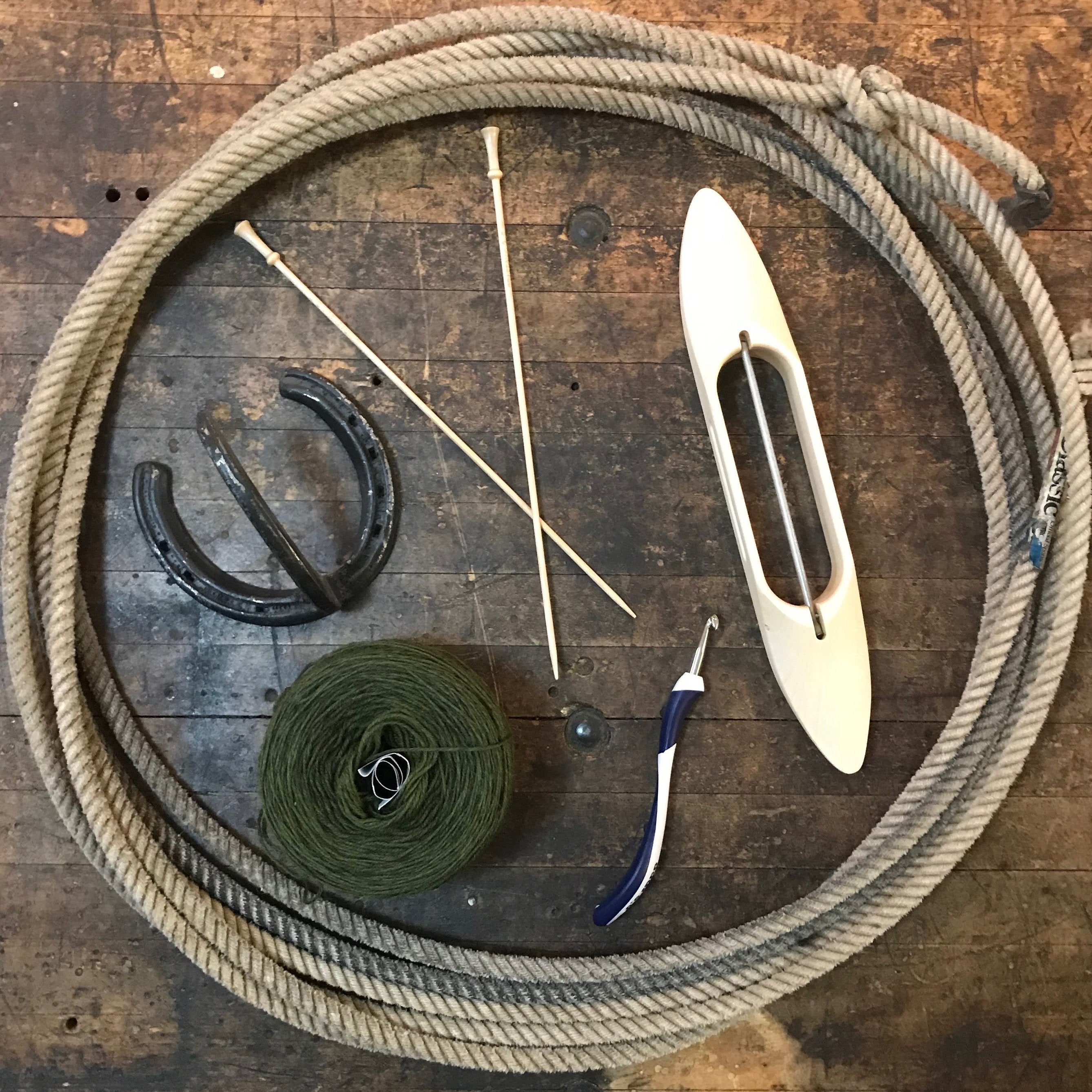 A lariat filled with fiber arts tools