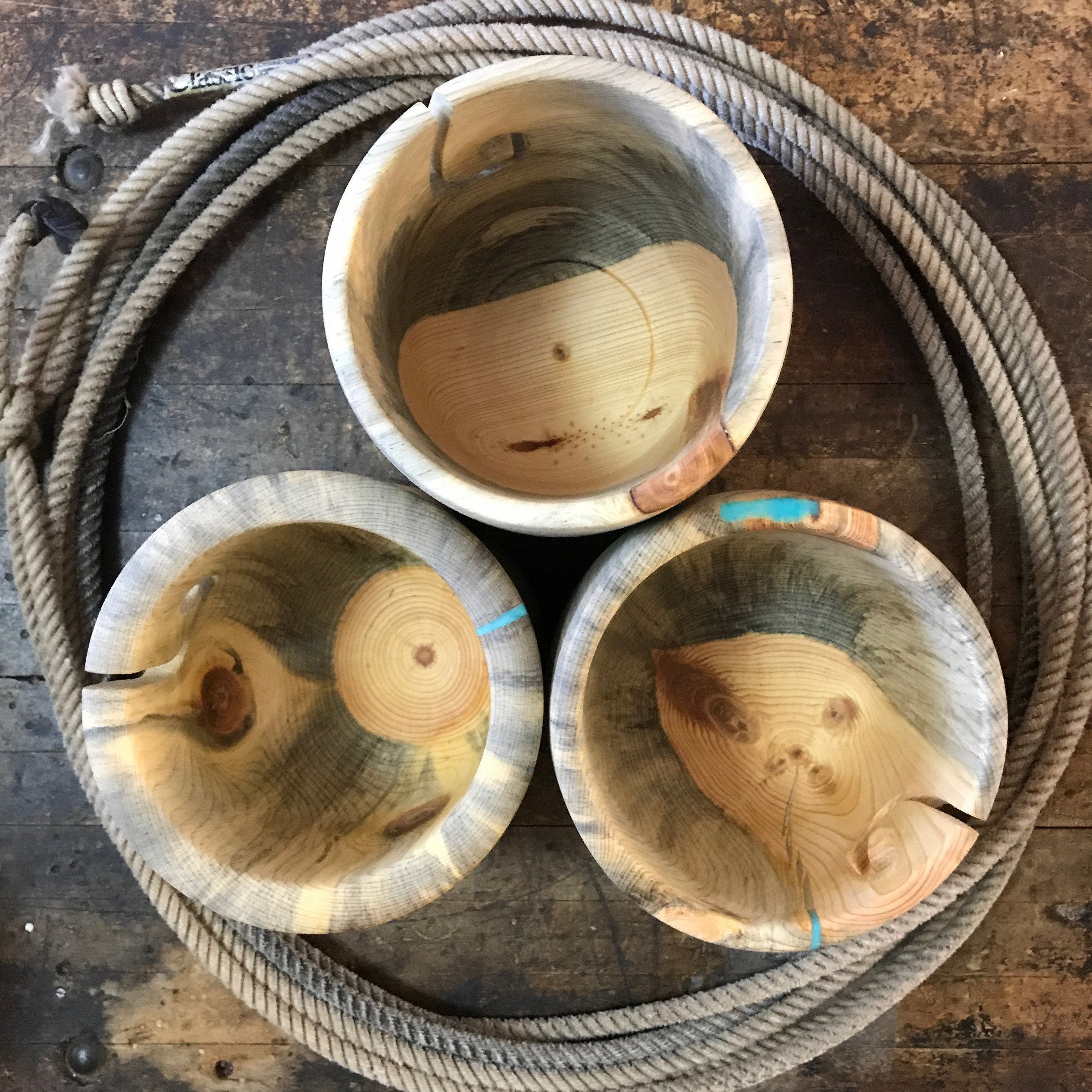 A lariat filled with wooden yarn bowls