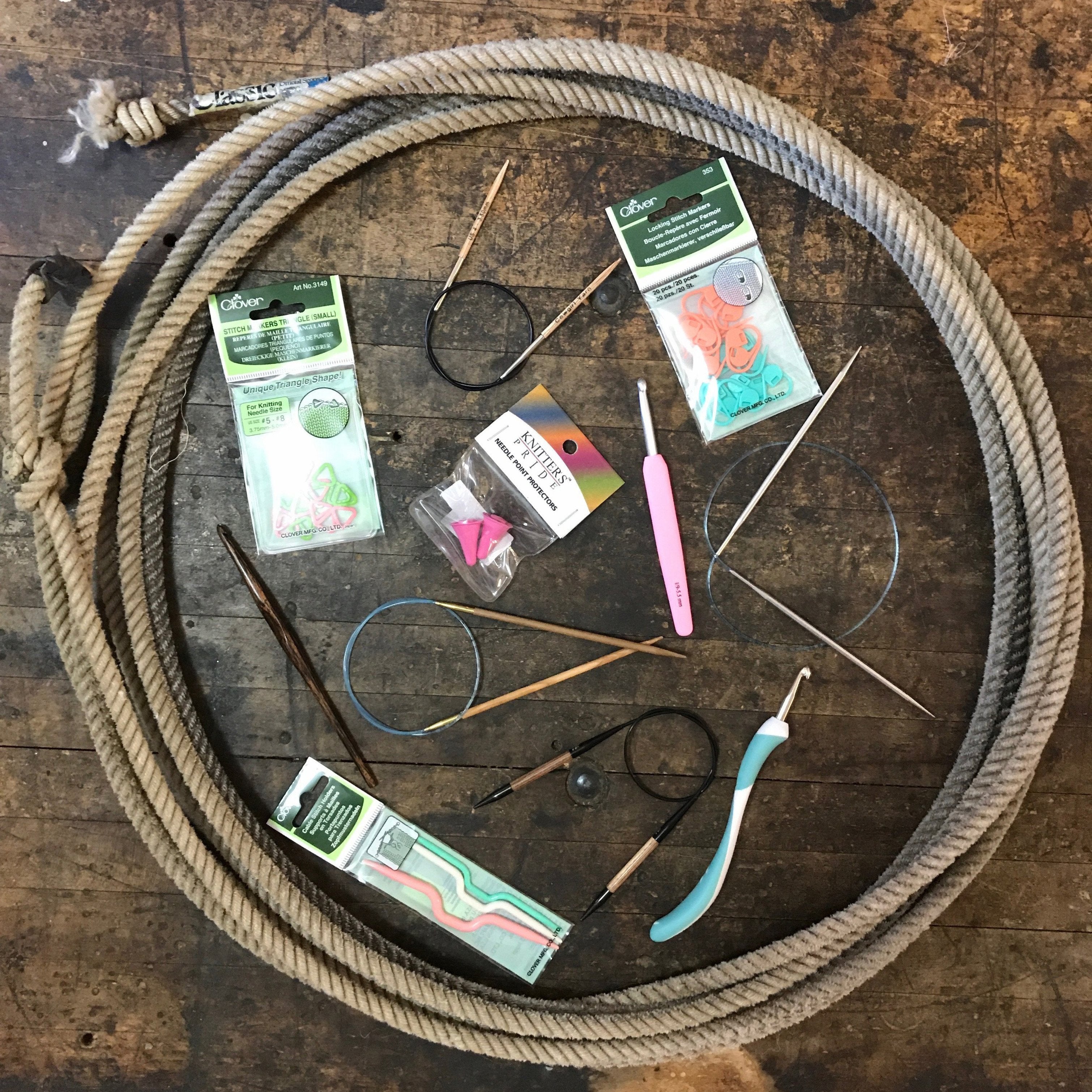 A lariat filled with various knitting tools