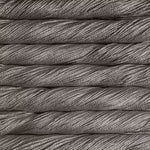 A close-up texture shot of twisted gray yarn or thread stacked horizontally, showing the fine strands and heathered gray color.