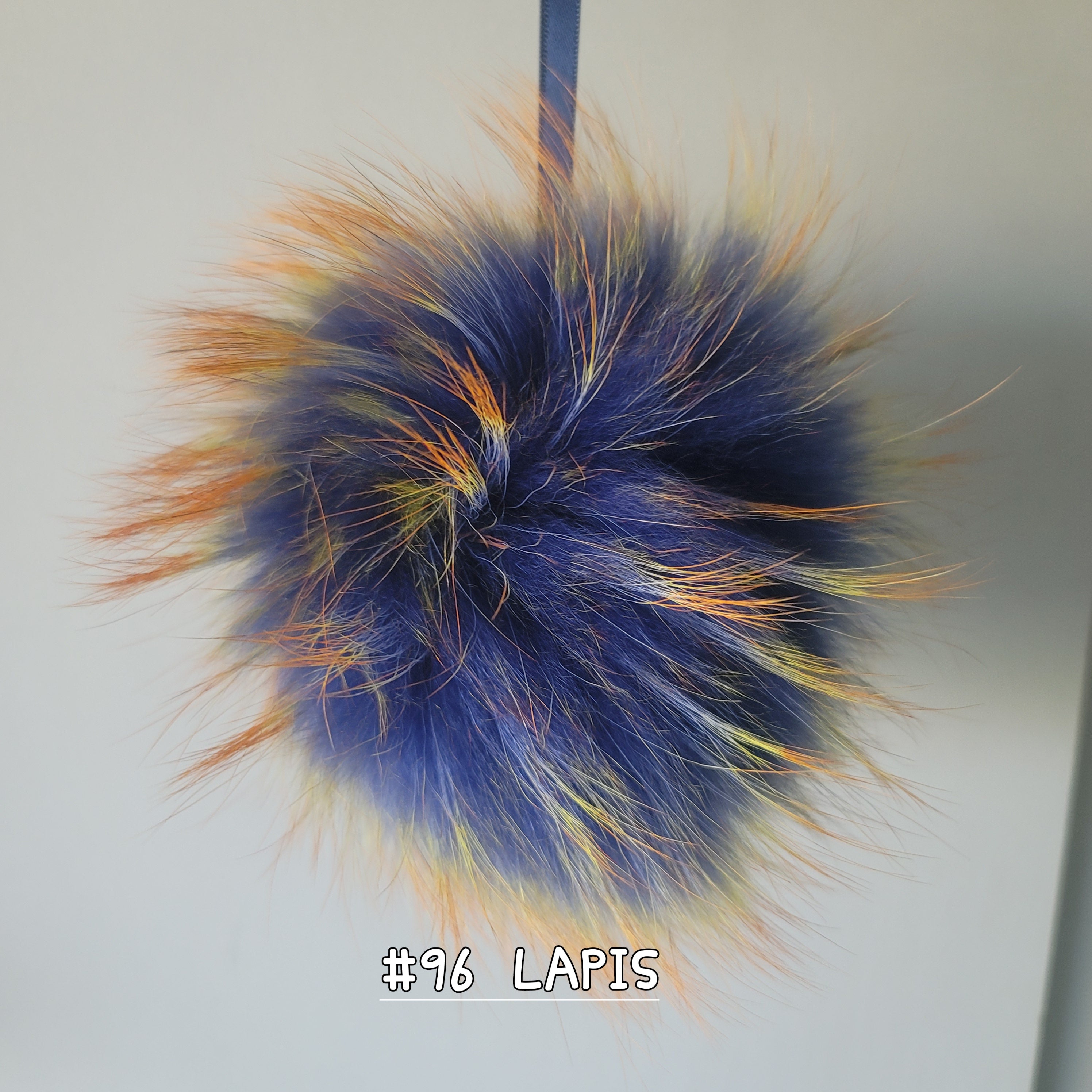 Fur Pompoms Small by Schildkraut color blue and orange