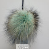 Fur Pompoms Small by Schildkraut color sage and tan