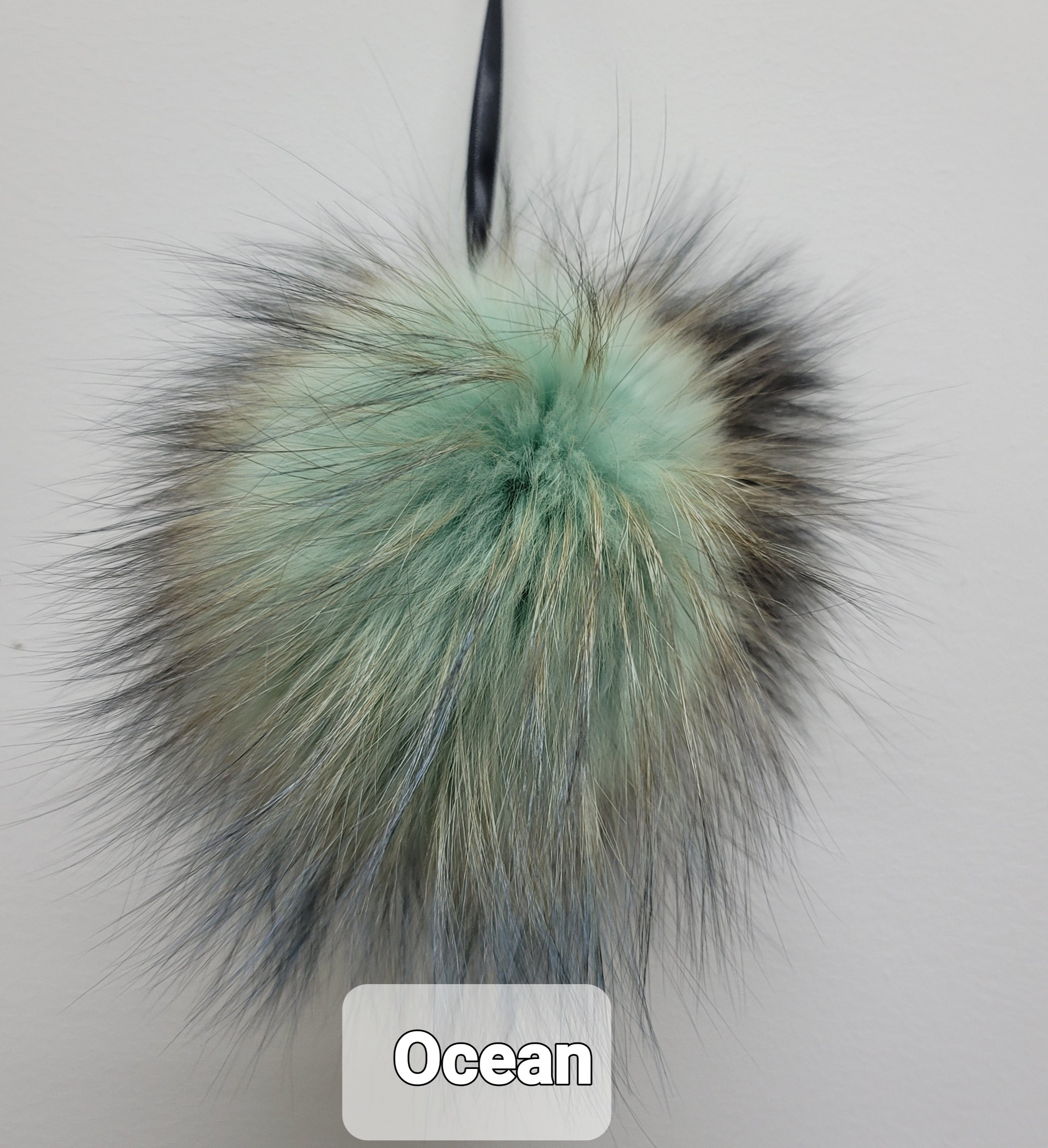 Fur Pompoms Small by Schildkraut color sage and tan