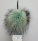 Fur Pompoms Small by Schildkraut color sage and tan