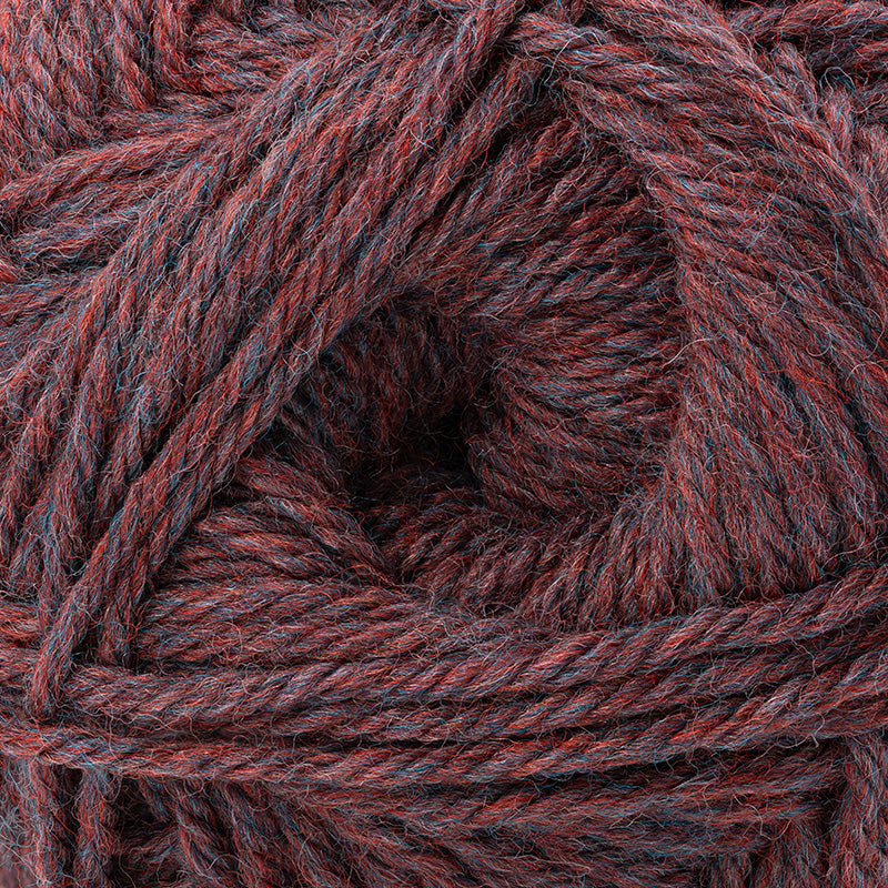 A close-up of twisted yarn strands in a heathered marled colorway of dark red, burgundy, and charcoal gray.