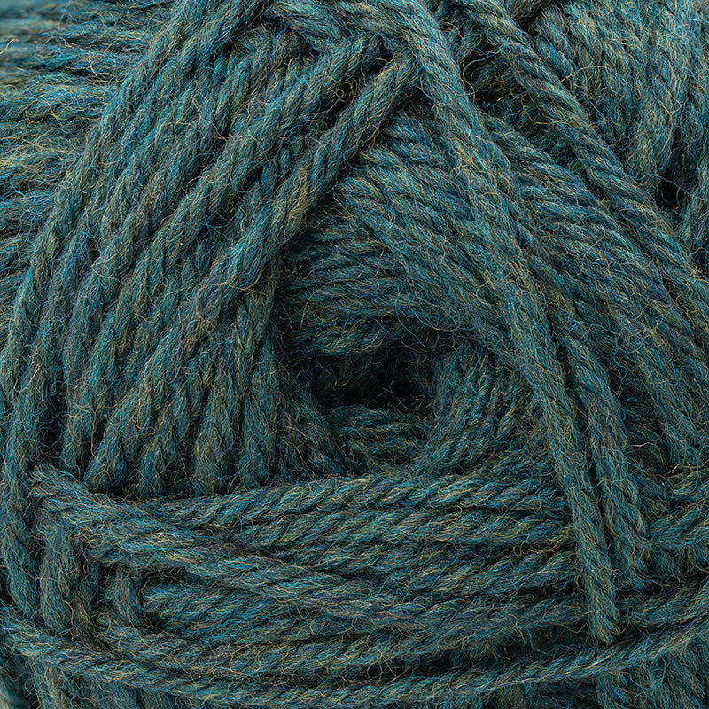 A close-up of a ball of yarn in a heathered teal blue-green color, showing the twisted plies and soft texture.