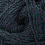 A close-up of dark teal and purple variegated yarn wound in a spiral pattern, showing the thick twisted texture of the fibers.