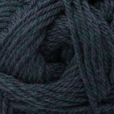A close-up of dark teal and purple variegated yarn wound in a spiral pattern, showing the thick twisted texture of the fibers.