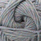 A close-up of twisted yarn wound into a skein, showing a variegated color mix of dusty blue, sage green, lavender, and soft pink.