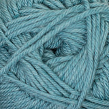 A close-up of dusty light blue-gray yarn strands wound together, filling the entire frame.