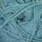 A close-up of dusty light blue-gray yarn strands wound together, filling the entire frame.