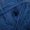 A close-up of a ball of twisted yarn in a heathered periwinkle blue and purple colorway.