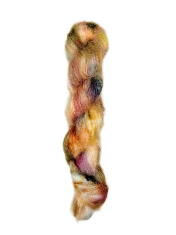 Skein of superkid mohair silk lace weight yarn color pink blue brown