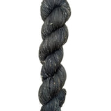 Skein of hand dyed BFL Tweed Yarn color steel grey 