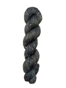 Skein of hand dyed BFL Tweed Yarn color steel grey 