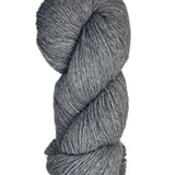 A skein of Berroco Vintage Wool Yarn in the color smoke grey