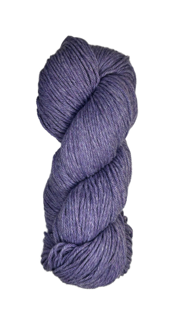 A skein of Berroco Vintage Wool Yarn in the color light heathered purple