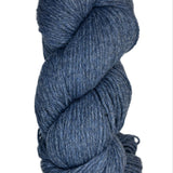 A skein of Berroco Vintage Wool Yarn in the color heathered navy blue