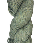 A skein of Berroco Vintage Worsted yarn color Okra green with blue and yellow marl