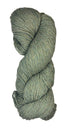 A skein of Berroco Vintage Worsted yarn color Okra green with blue and yellow marl