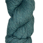 A skein of Berroco Vintage Wool Yarn in the color heathered teal with green