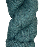 A skein of Berroco Vintage Wool Yarn in the color heathered teal with green