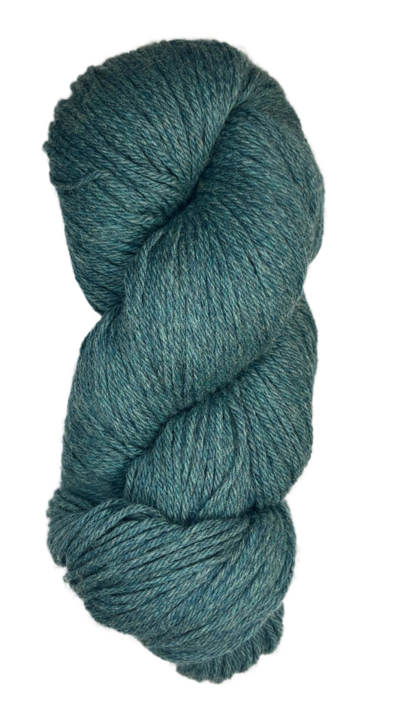 A skein of Berroco Vintage Wool Yarn in the color heathered teal with green