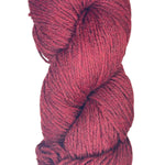 A skein of Berroco Vintage Worsted yarn color Cherry Red with Black marl