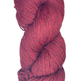 A skein of Berroco Vintage Worsted yarn color Cherry Red with Black marl