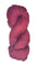 A skein of Berroco Vintage Worsted yarn color Cherry Red with Black marl