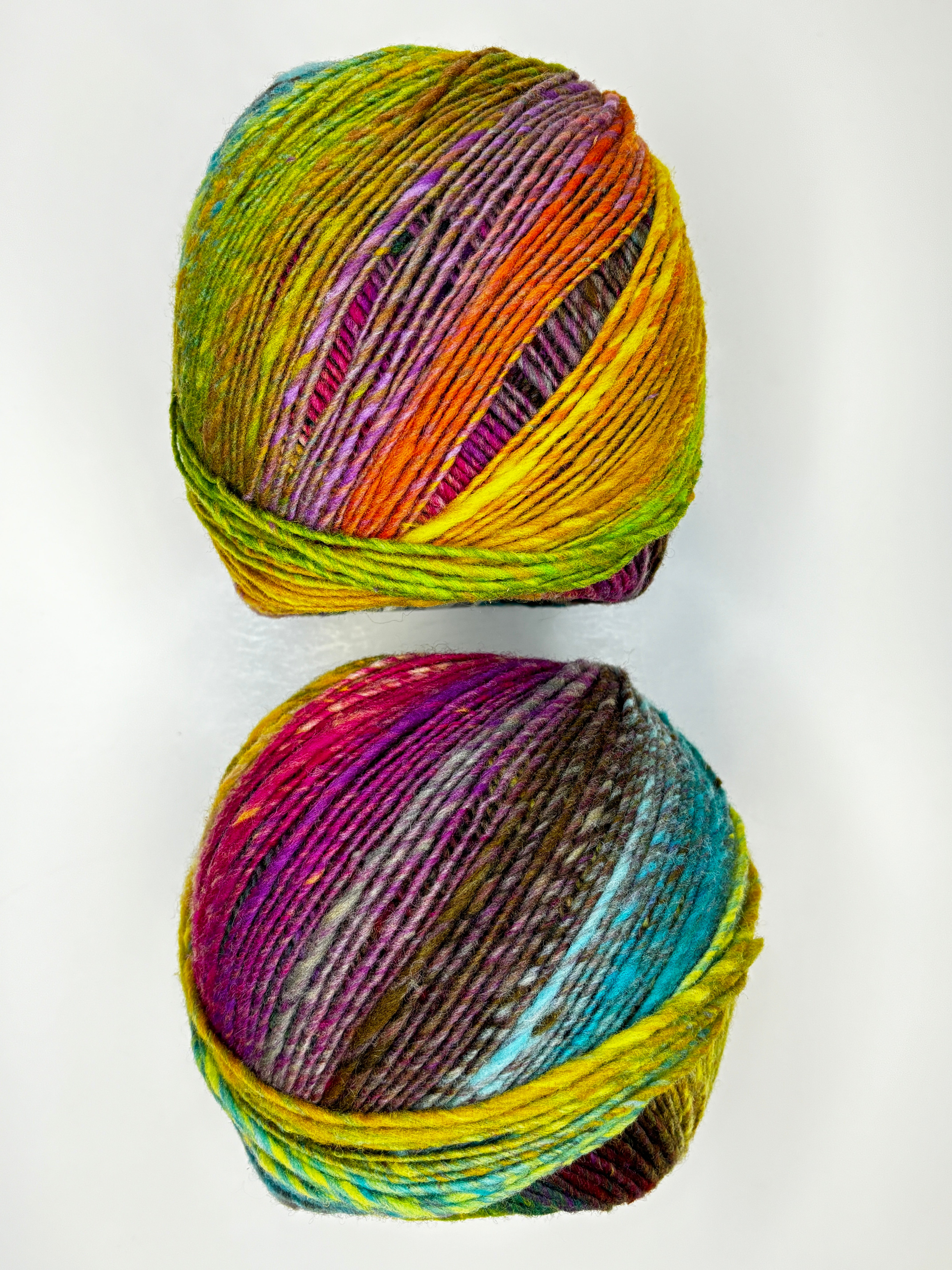 yellow orange pink purple blue ball of yarn 