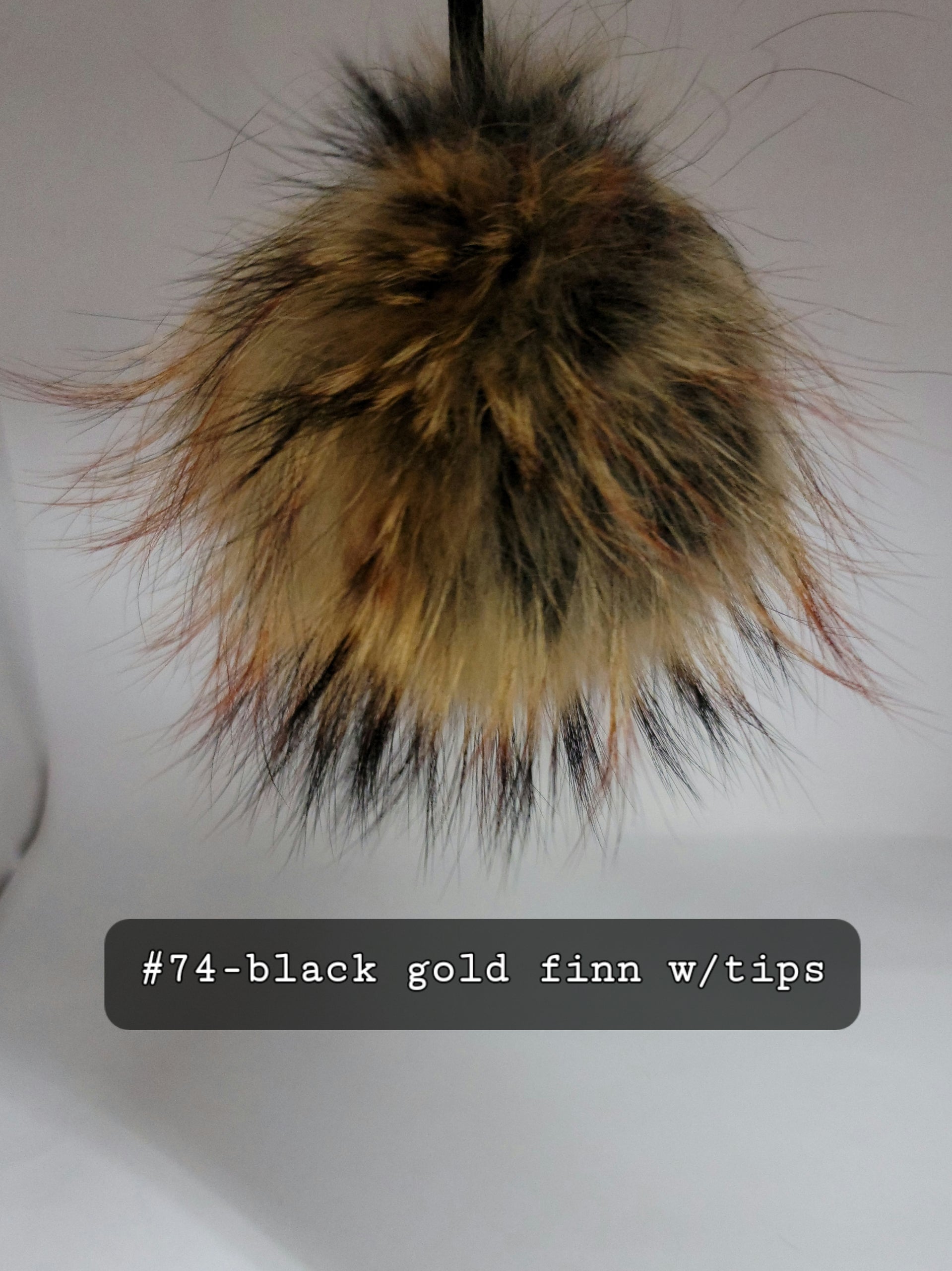 Fur Pompoms Small by Schildkraut color black and brown