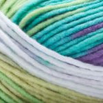 Detailed image of Universal Yarn Maman Acrylic Yarn in the colors teal white green purple