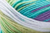 Detailed image of Universal Yarn Maman Acrylic Yarn in the colors teal white green purple