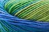 Detailed image of Universal Yarn Maman Acrylic Yarn in the colors green blue