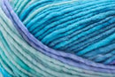 Detailed image of Universal Yarn Maman Acrylic Yarn in the colors blue purple light green teal