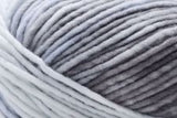 Detailed image of Universal Yarn Maman Acrylic Yarn in the colors white grey black