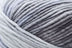 Detailed image of Universal Yarn Maman Acrylic Yarn in the colors white grey black