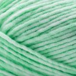 Detailed image of Universal Yarn Maman Acrylic Yarn in the colors  green