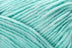 Detailed image of Universal Yarn Maman Acrylic Yarn in the colors  light teal