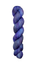 A skein of hand-dyed fingering/sock yarn color grey blue purple speckles
