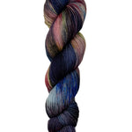 A skein of hand-dyed fingering/sock yarn color pink grey navy brown black 