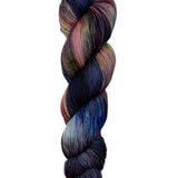 A skein of hand-dyed fingering/sock yarn color pink grey navy brown black 