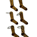 Wooden stitch markers with engraved detail of socks