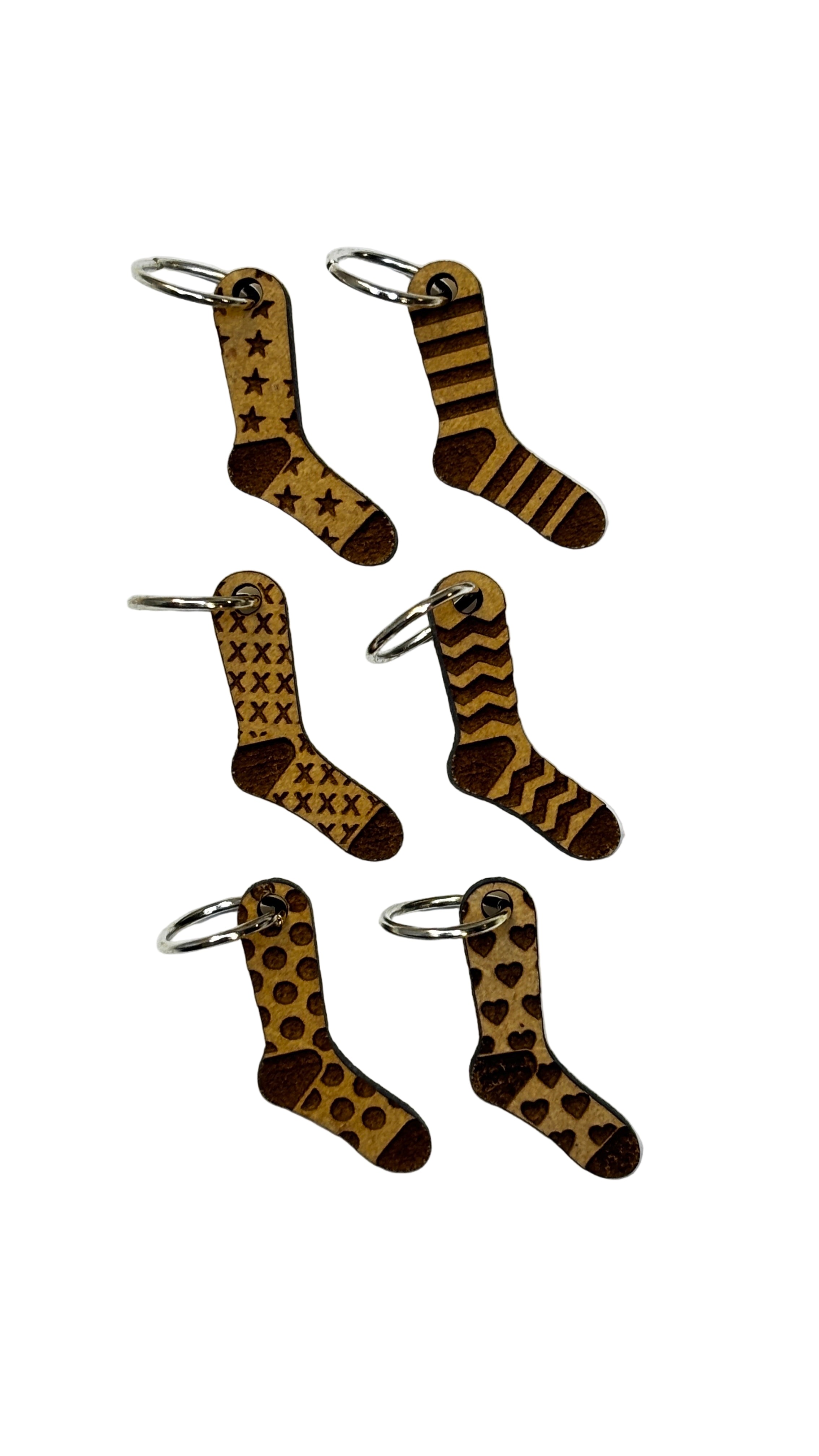 Wooden stitch markers with engraved detail of socks